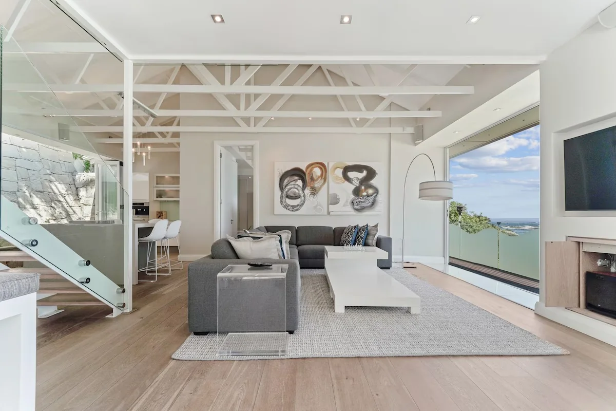 Open-plan living and dining space at Bungalow 69 with Atlantic Ocean views